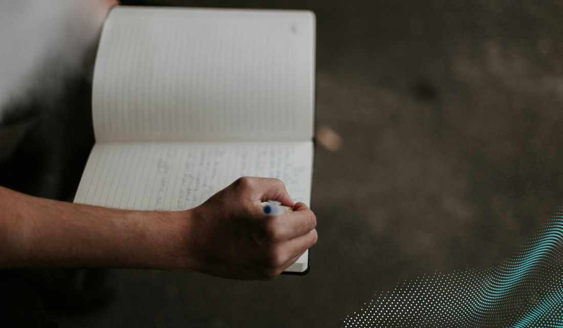 A person writing in a journal