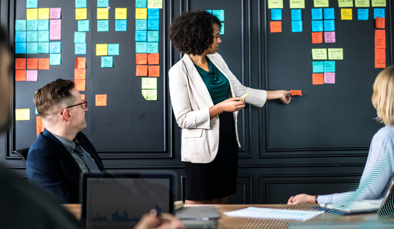 A woman is leading a meeting in a professional space