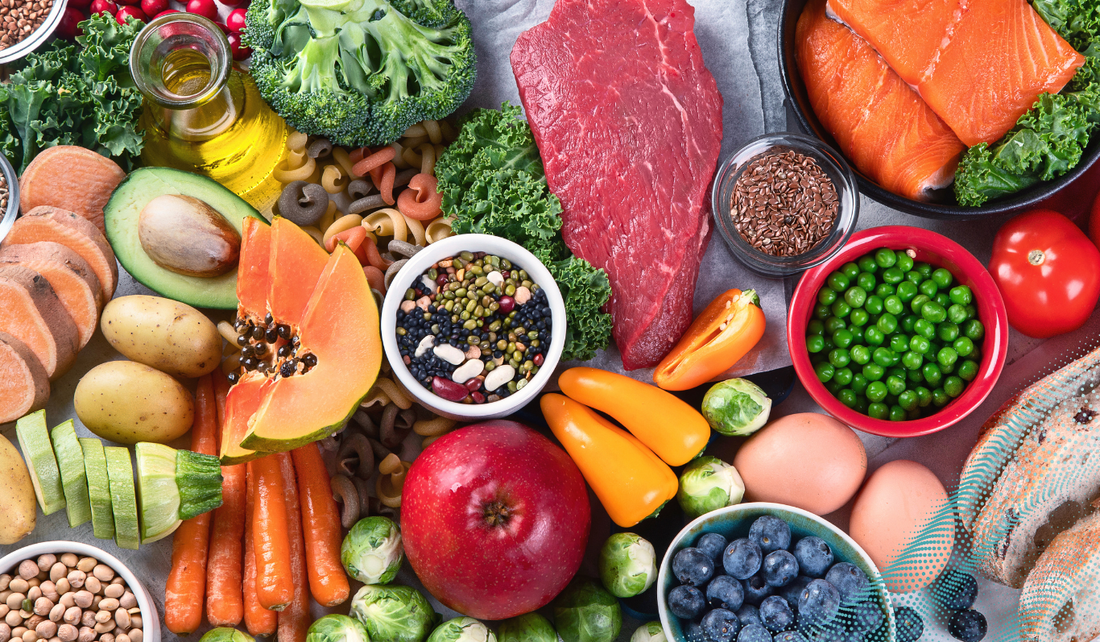 A mixture of healthy foods including fruit, vegetables, meat and fish