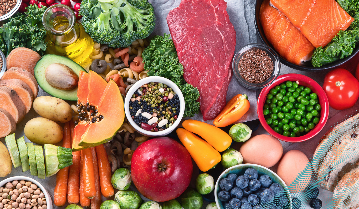 A mixture of healthy foods including fruit, vegetables, meat and fish