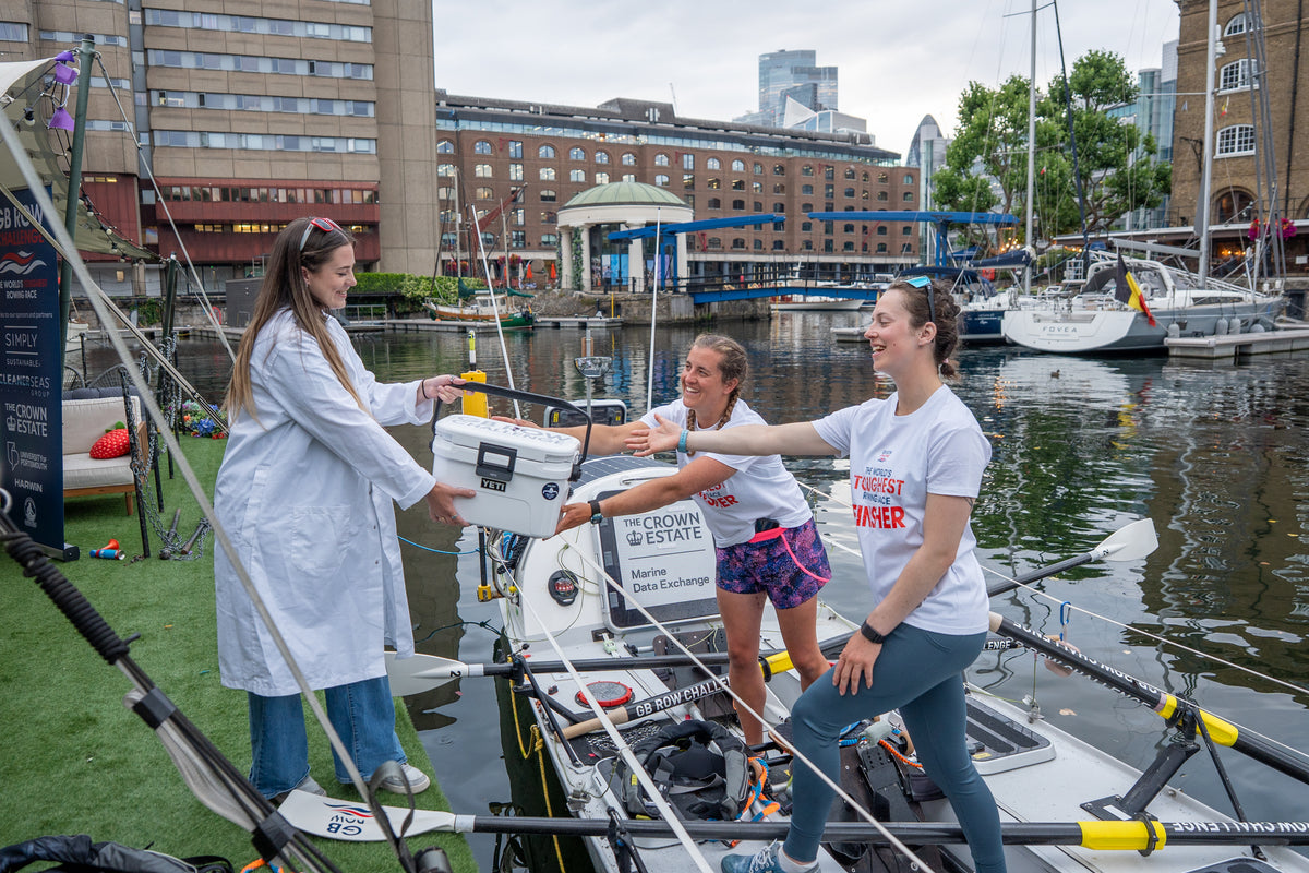 Team Nautilus crew at the dock receiving supplies before departure on the GB Row Challenge 2026